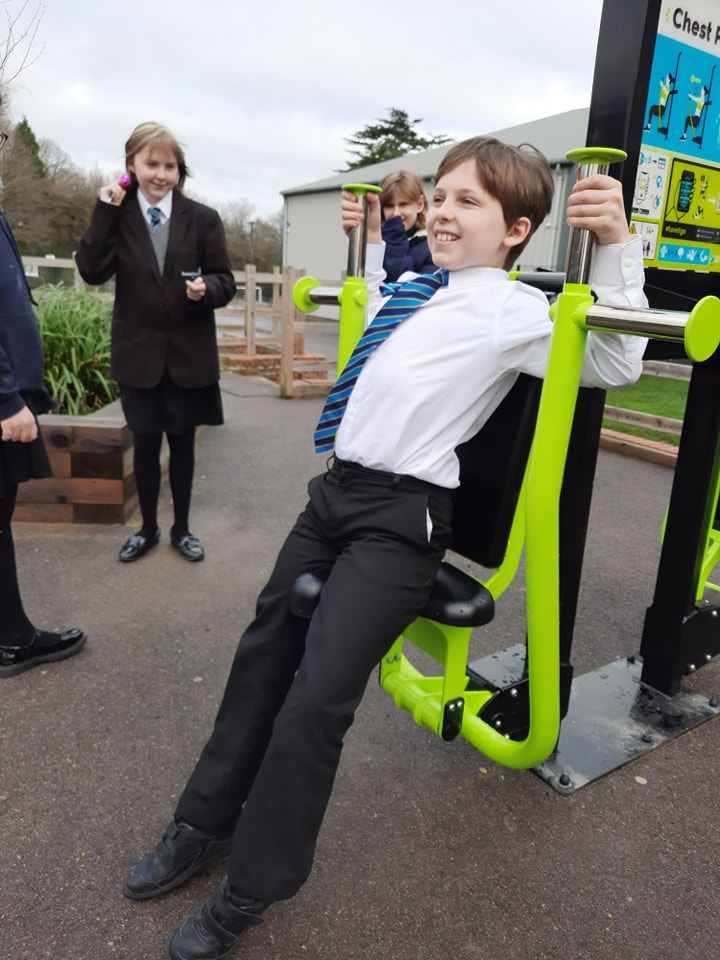 A photo showing some students using the apparatus in the new outdoor Gym on the academy grounds.