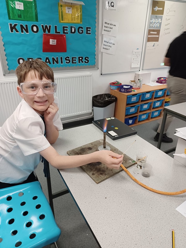 A student with a Bunsen burner