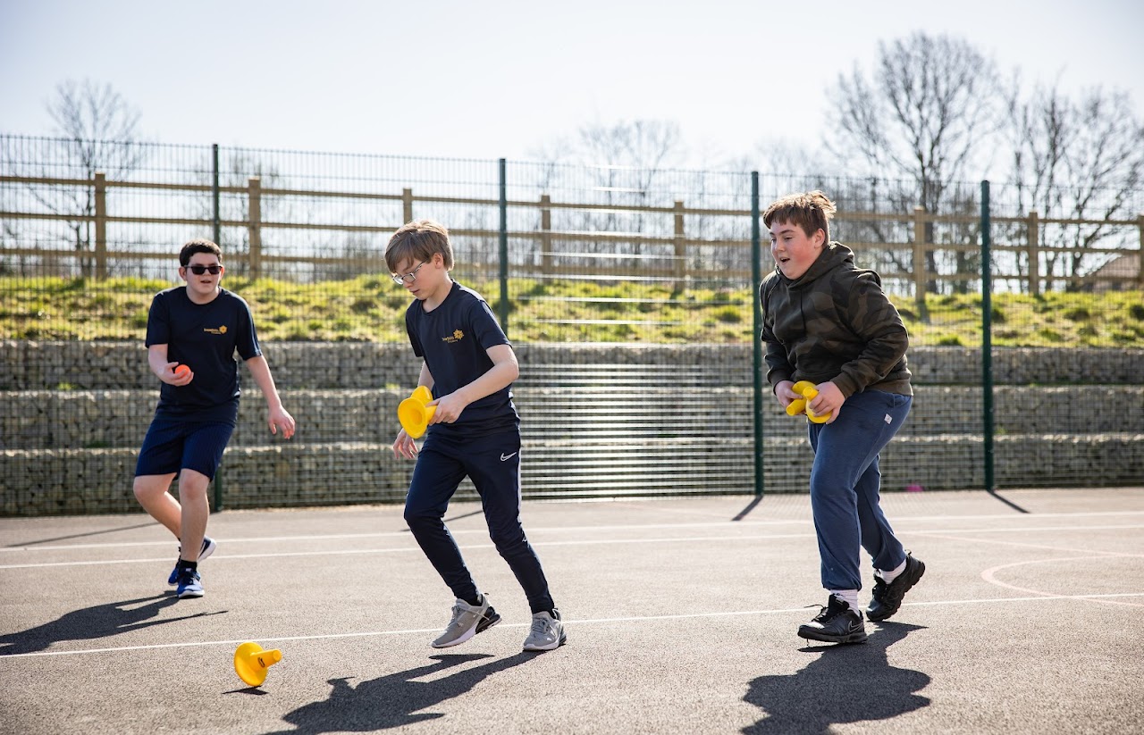 Students in PE kits on a court