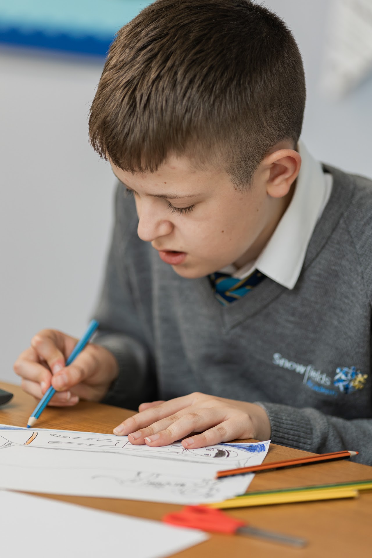 A student at a desk writing